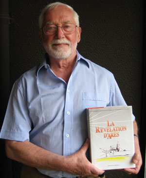 Brother Michel holding The Revelation of Arès